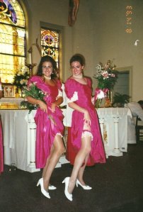 My sisters Susan and Nancy in raspberry taffeta bridesmaid dresses with matching garters. The picture taker (me) had the same outfit on. None of us should have EVER worn white shoes (wink, wink). On the alter, no less.